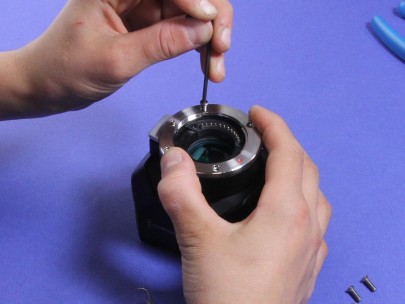 MFT flange being reinstalled over the shim stack